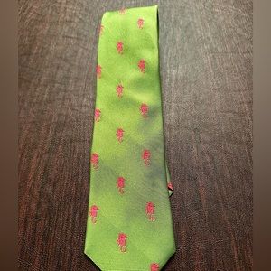 Iconic Lilly Pulitzer men’s silk tie in pink and green seahorse.